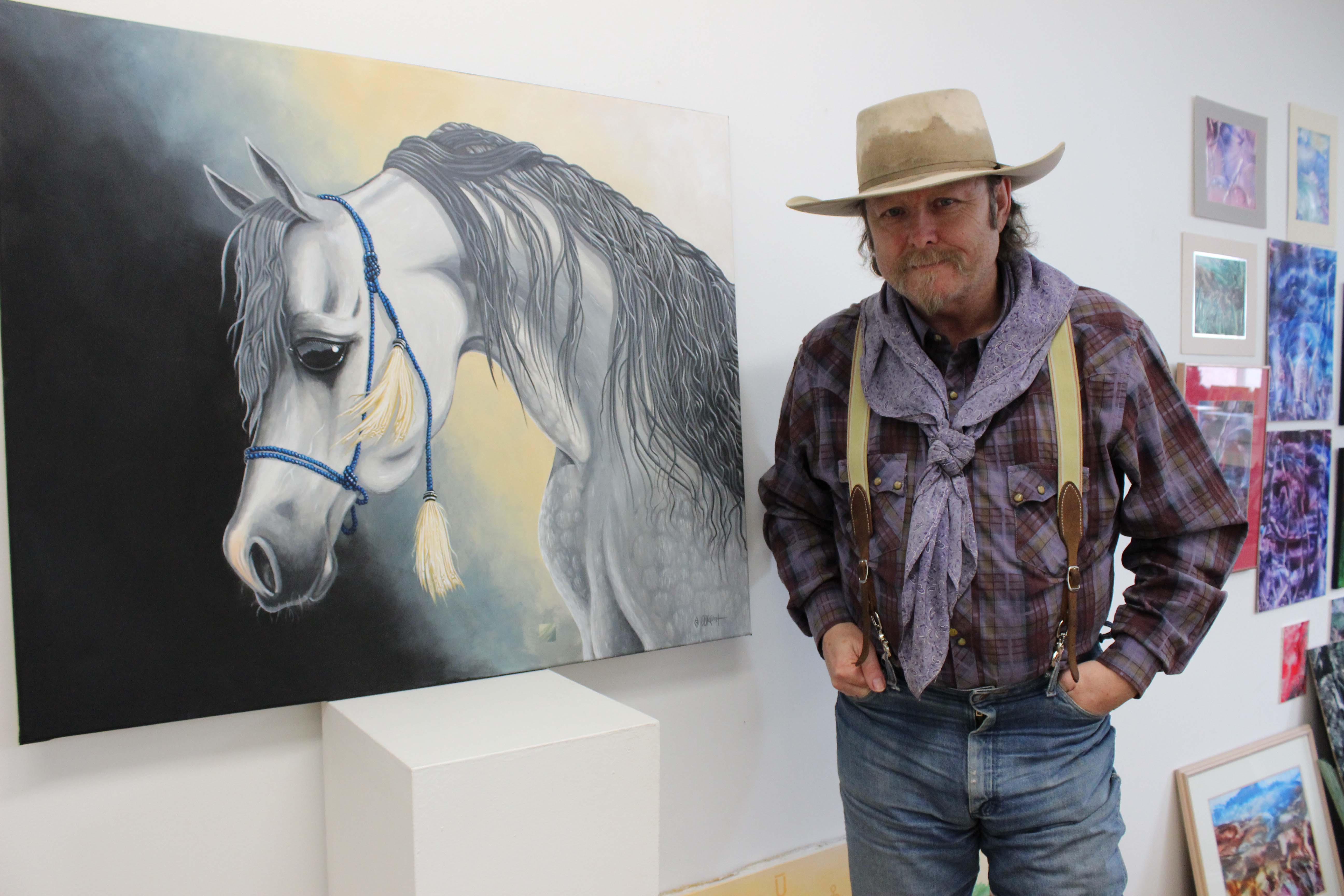 â€˜Diamond' Doug Keith shows a painting of an Arabian horse he created as a gift for his therapist.